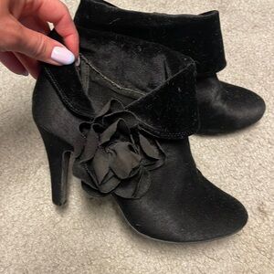 Black velvety booties with flower side detail